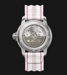 Rear view of Blancpain Fifty Fathoms Automatique 5007 12B44R NAFA showcasing its movement and pink-striped NATO strap